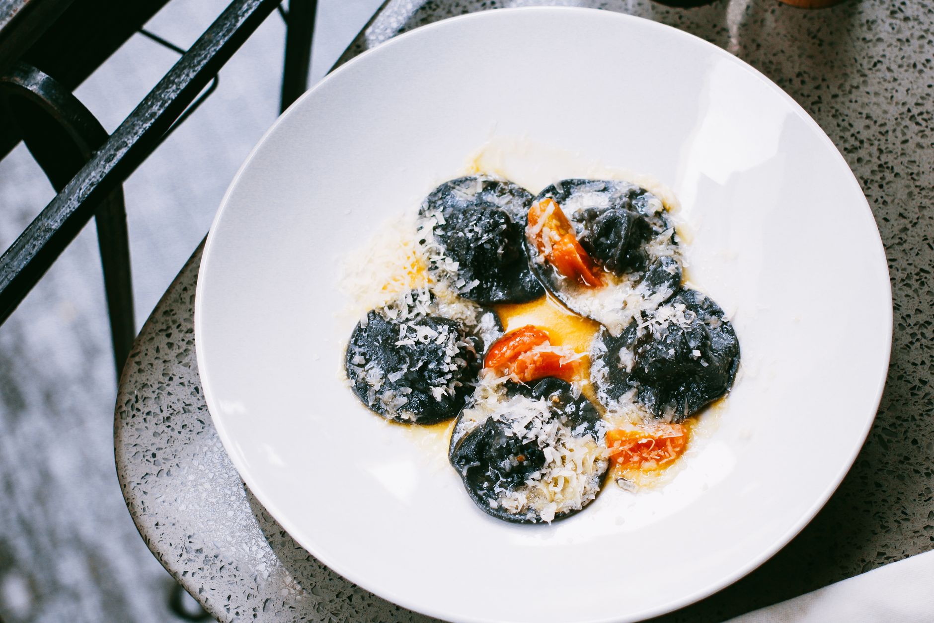 Black Squid Ink Ravioli with Tomato and Parmesan