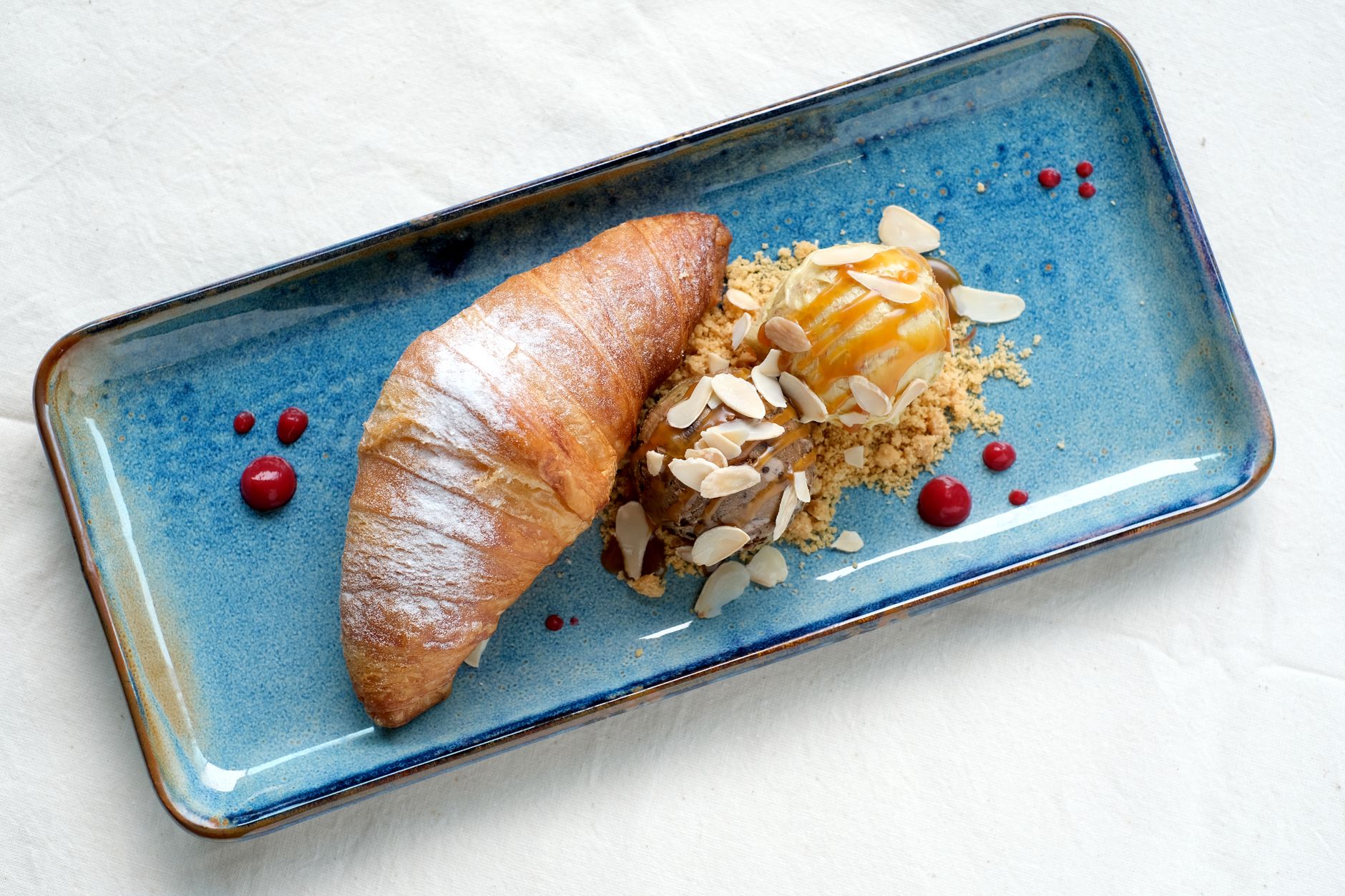 Croissant with Pastry Cream, Sliced Almonds, and Red Berries