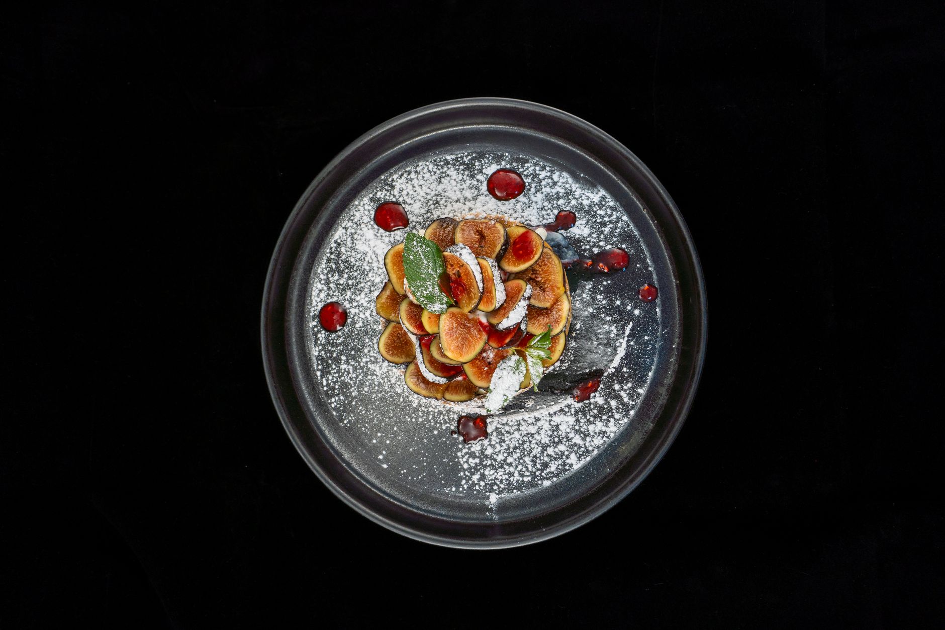 Fruit Tart with Powdered Sugar and Mint