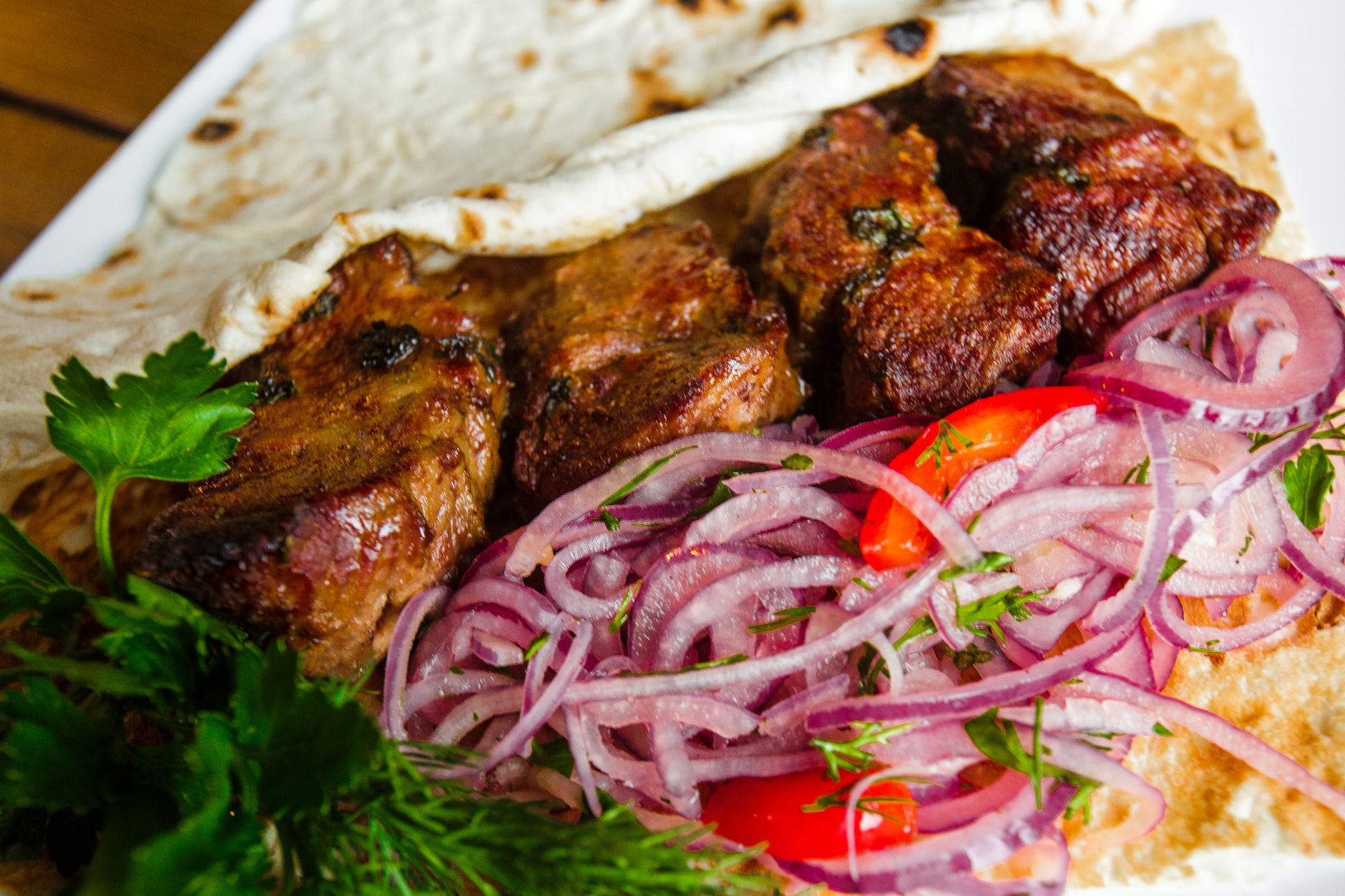 Grilled Meat Kebabs with Onion Salad and Flatbread