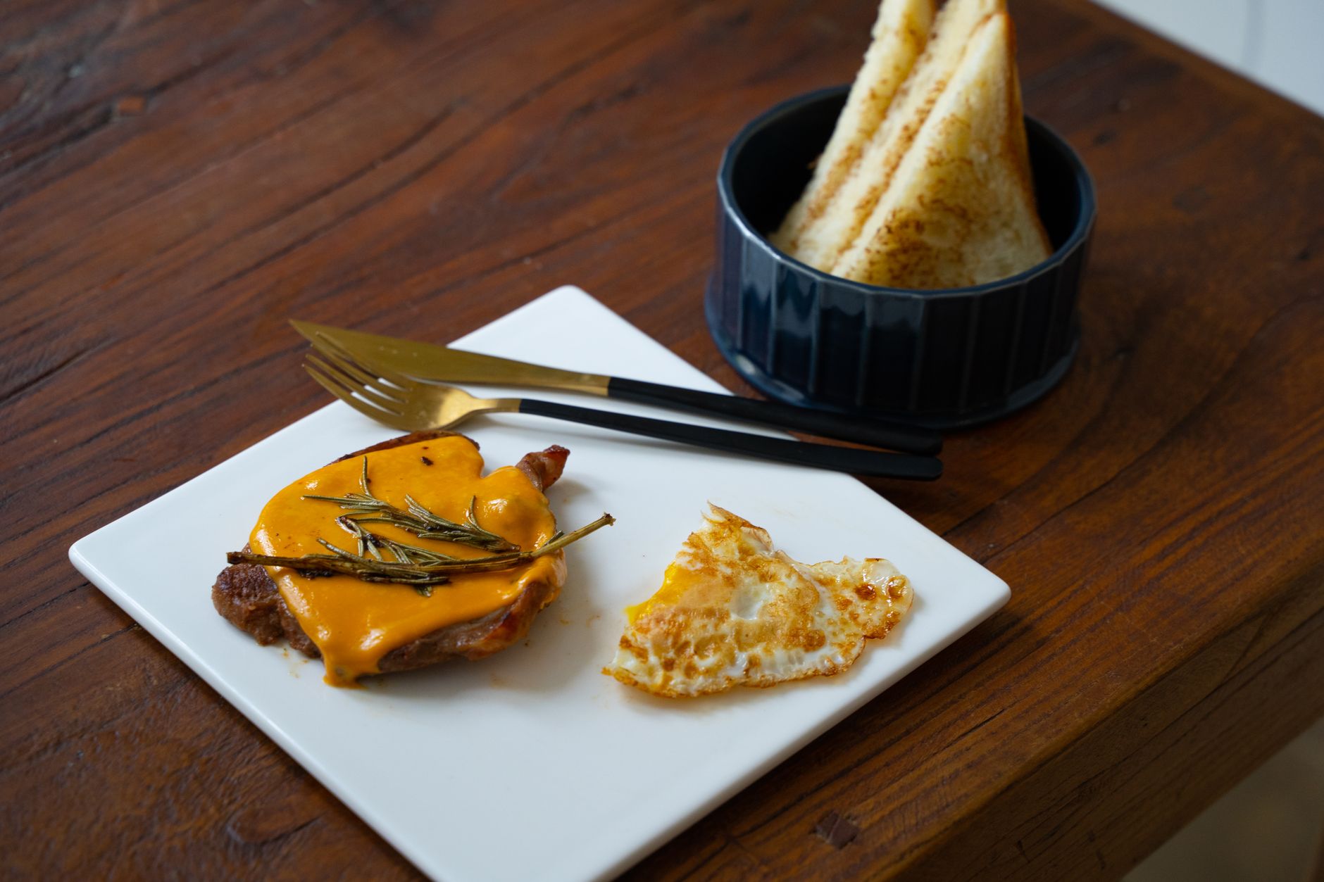 Grilled Steak with Melted Cheese and Rosemary