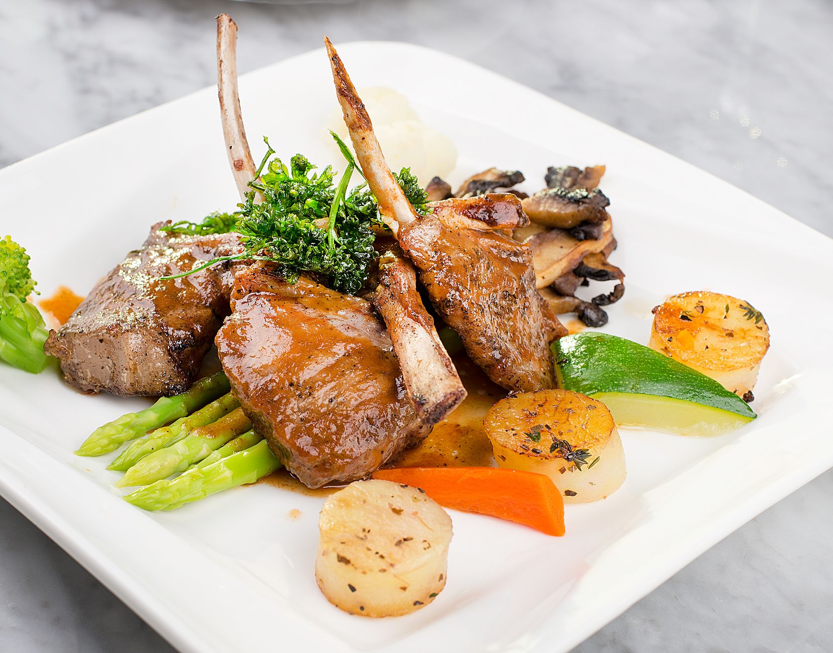 Lamb Chops with Scallops and Vegetables
