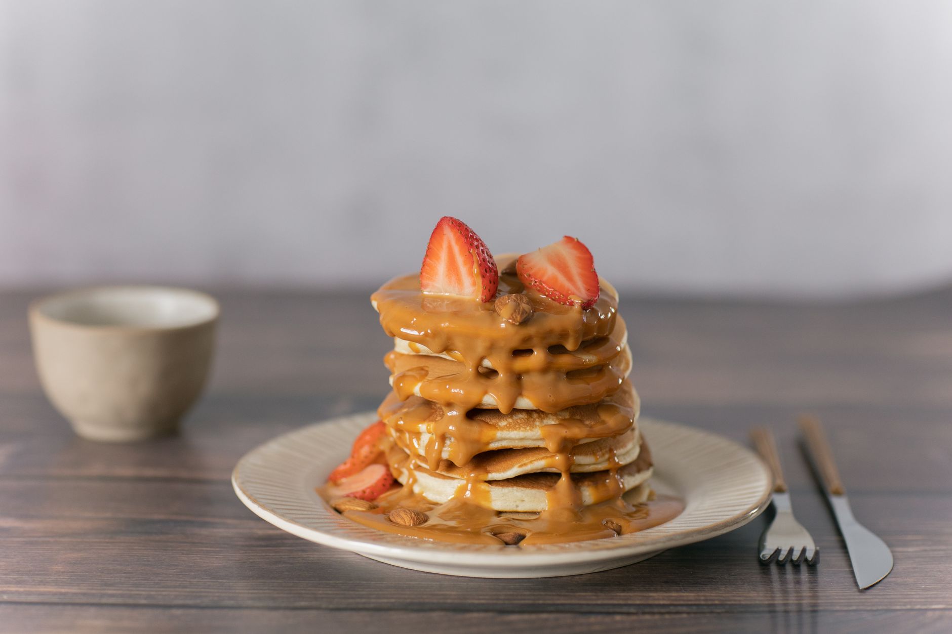 Pancakes with Strawberries and Peanut Butter Syrup