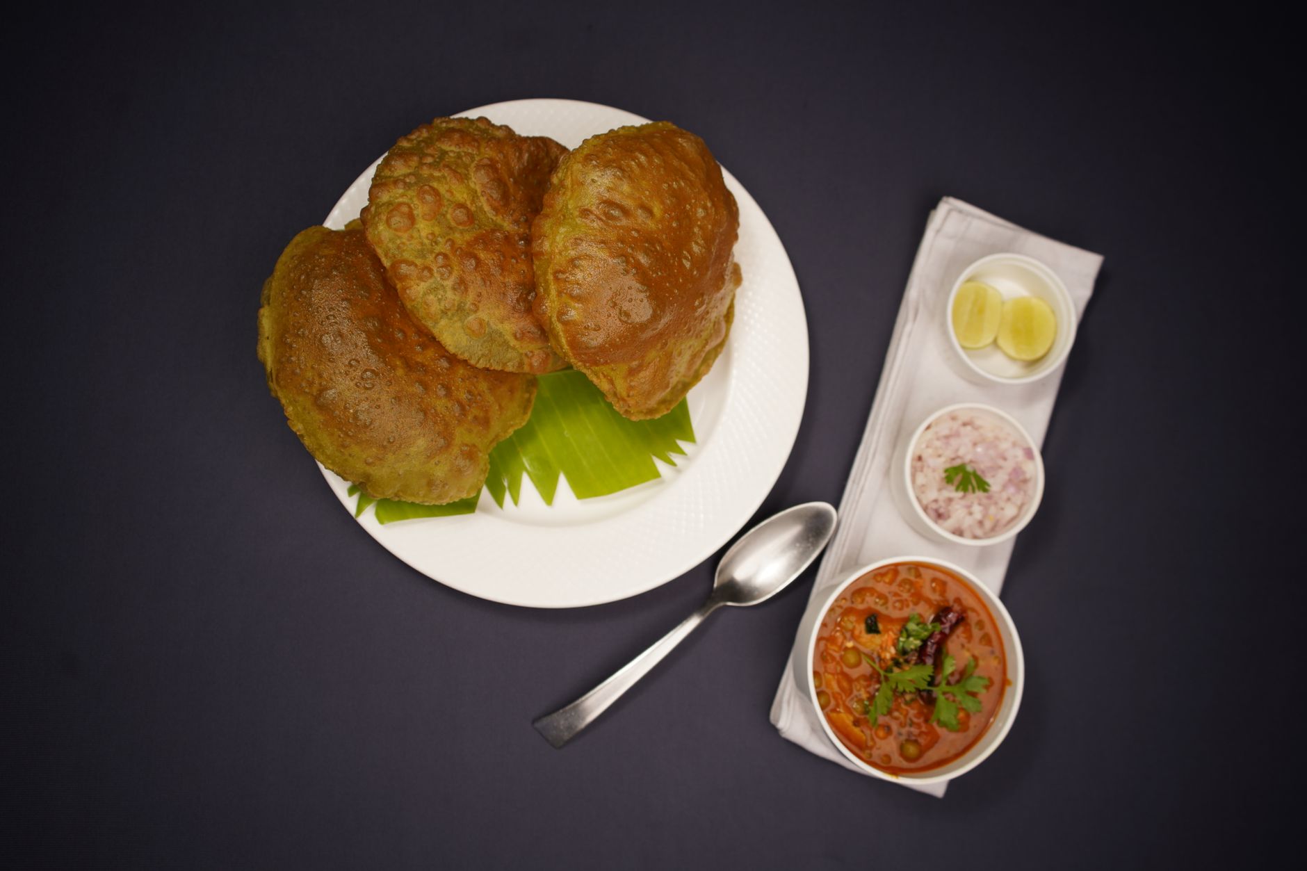 Puri with Chickpea Curry and Chutneys