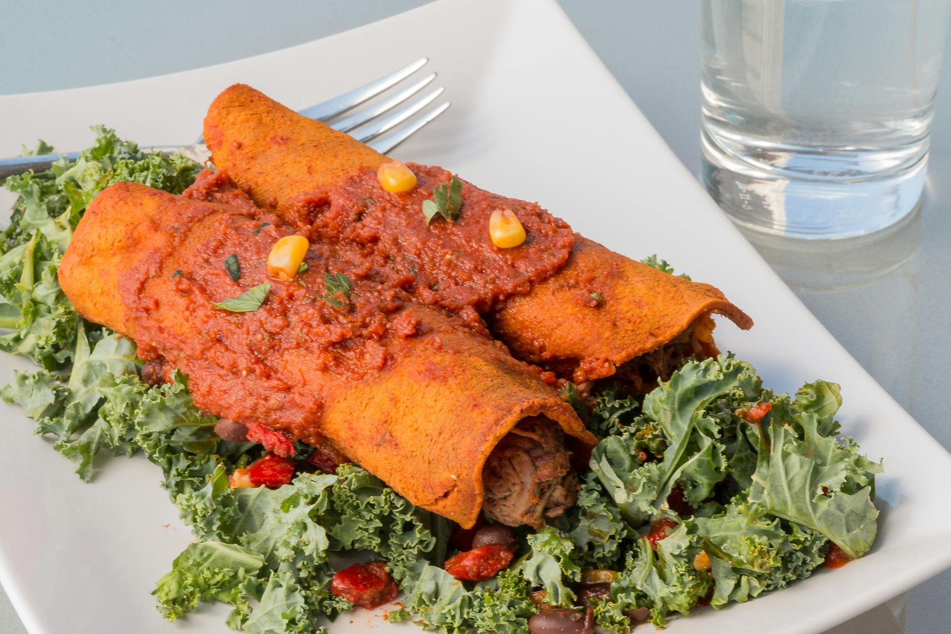 Cheesy Red Enchiladas with Crispy Kale