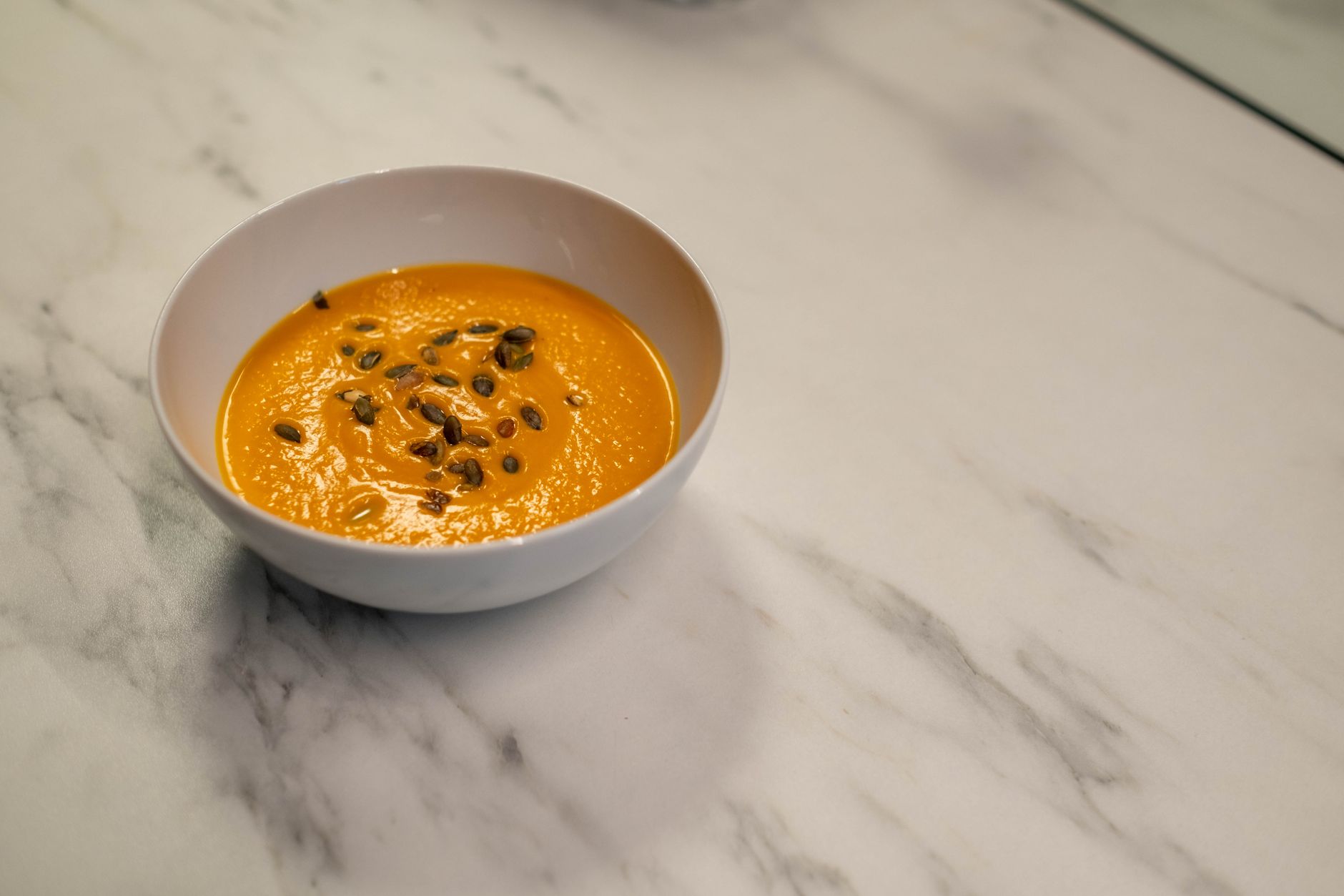Creamy Pumpkin Soup with Sage Swirl