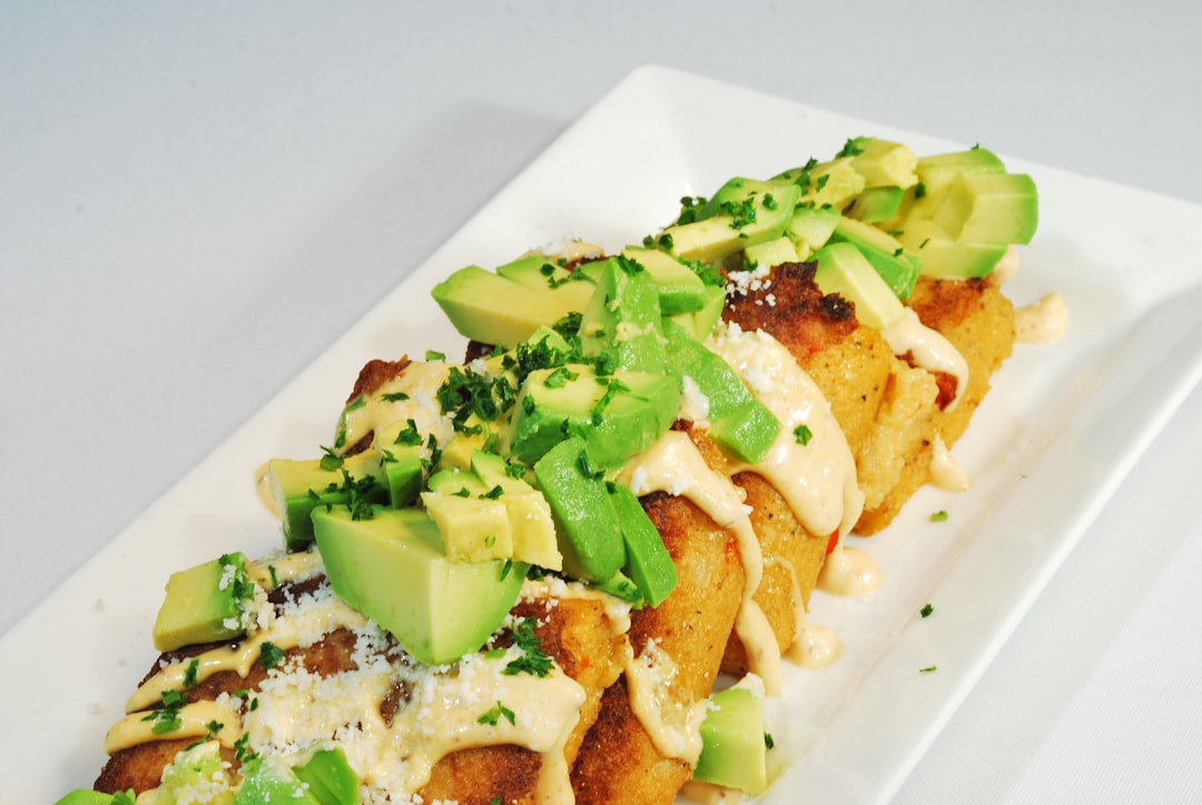 Crispy Chicken Taquitos with Lime Crema