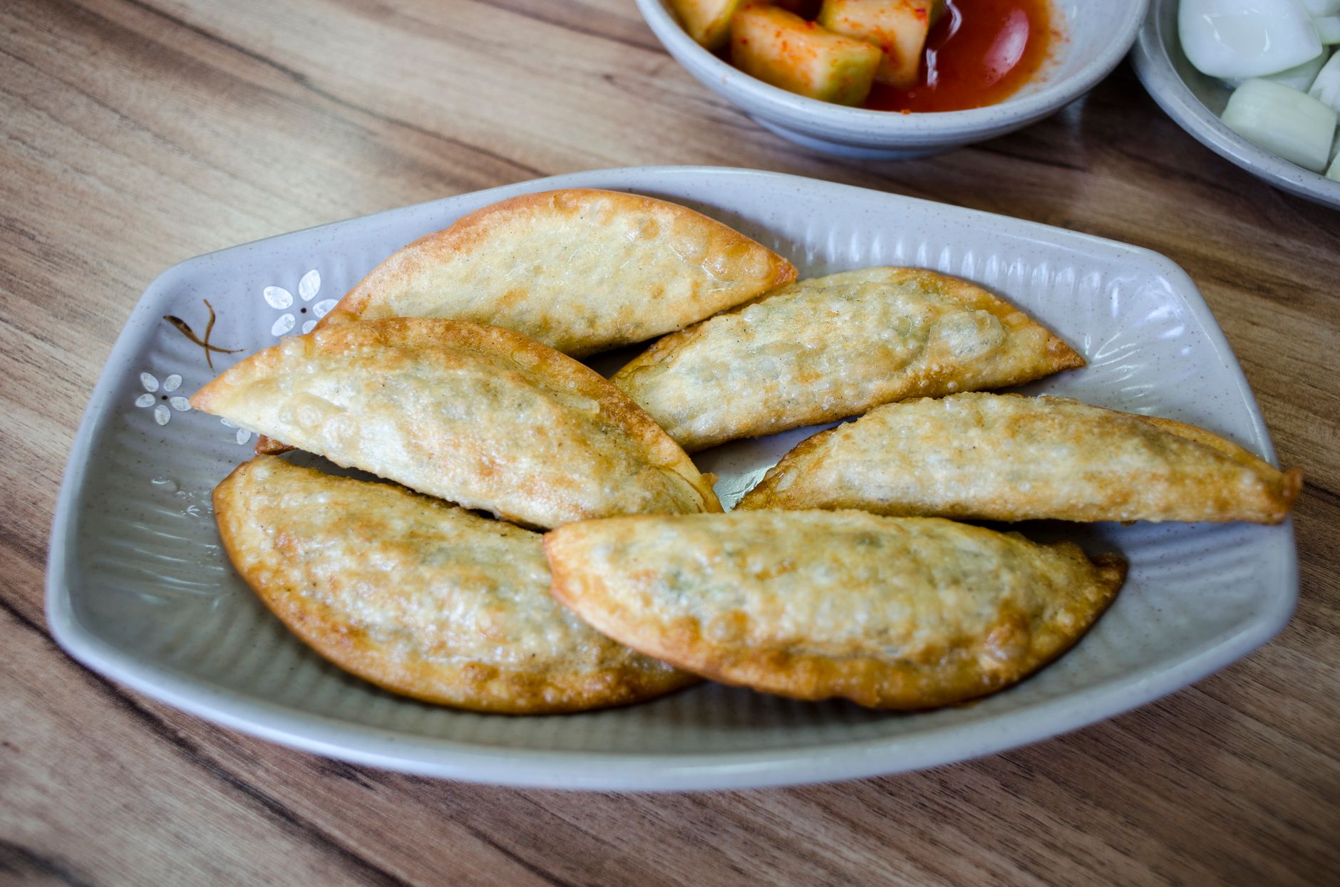 Crispy Pan-Fried Pork Gunmandu with Pickled Radish