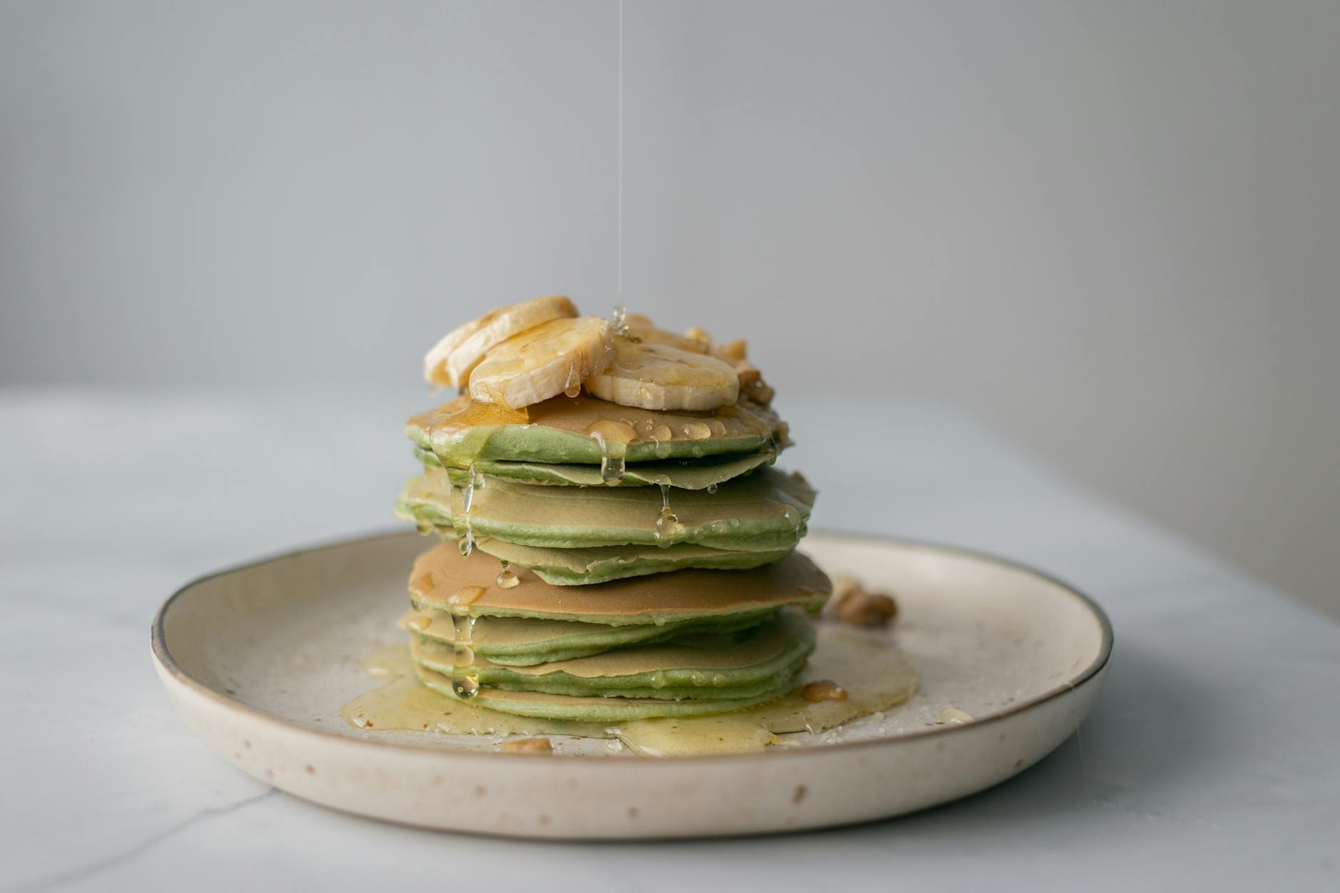 Green Banana Oat Pancakes with Honey & Walnuts
