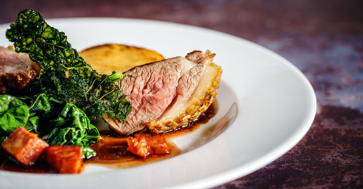 Pan-Seared Duck Breast with Crispy Kale and Red Wine Reduction