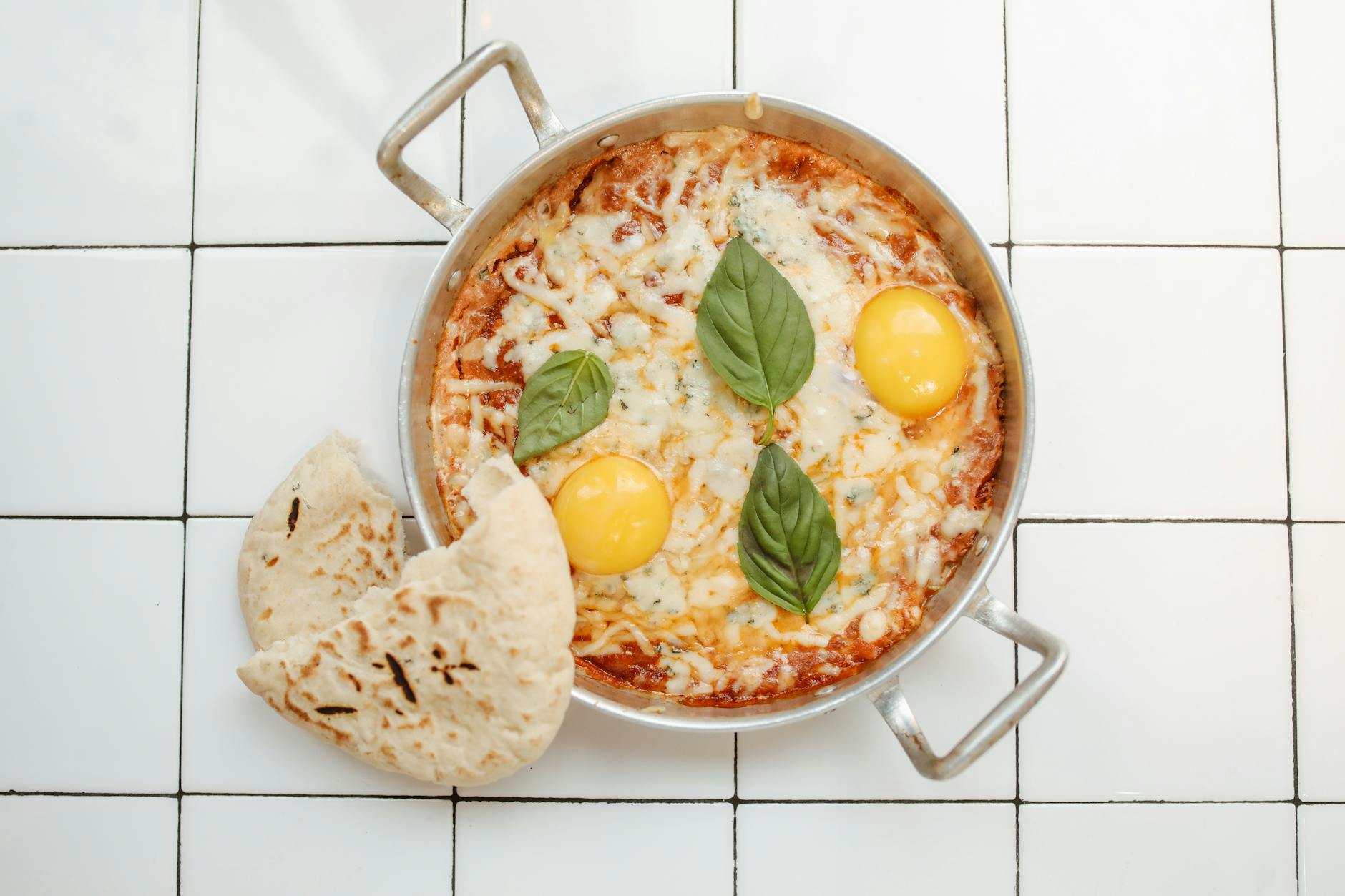 Shakshuka—Baked Eggs in Tomato Sauce & Pita