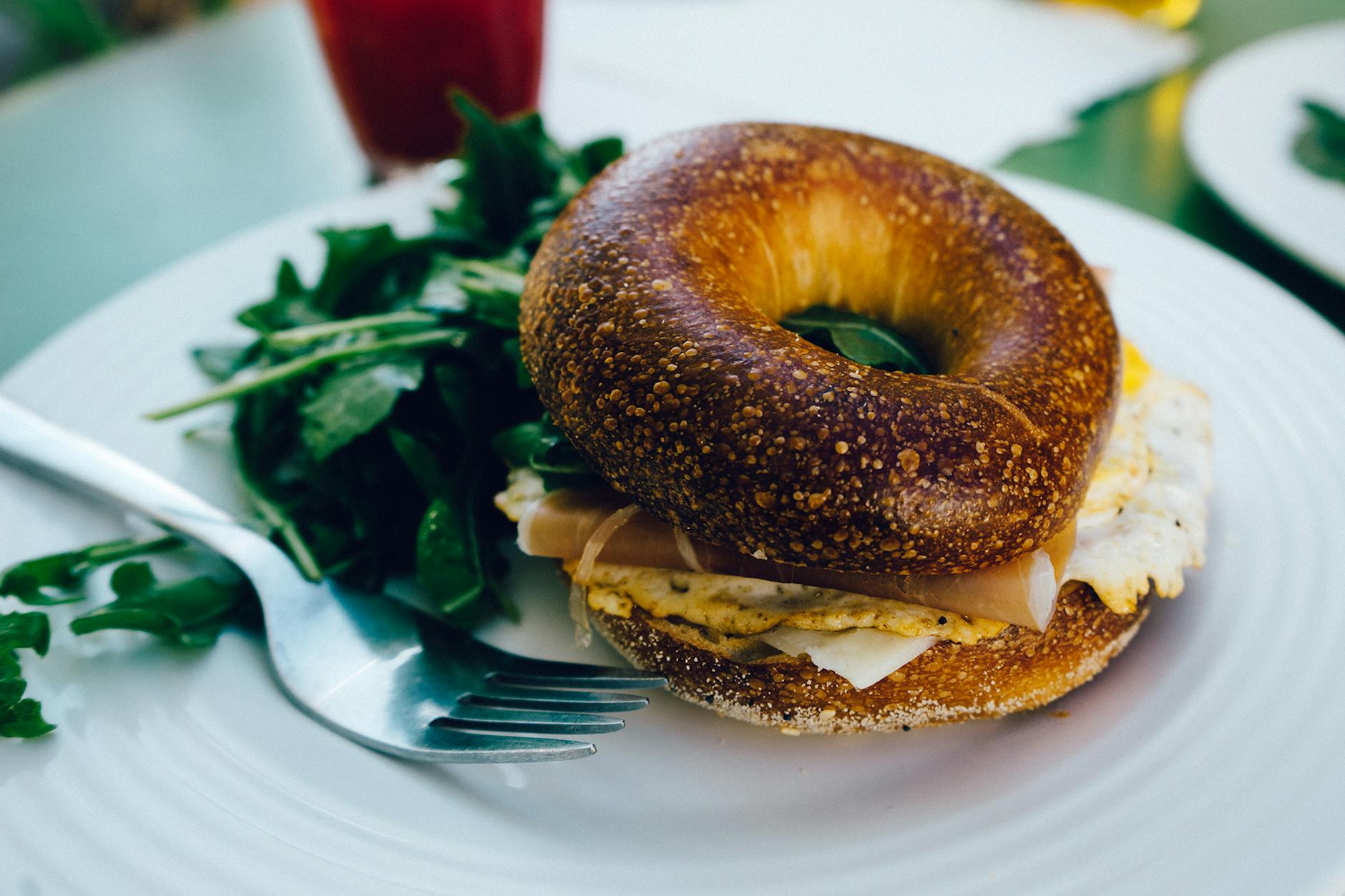 Toasted Bagel with Egg, Avocado & Arugula