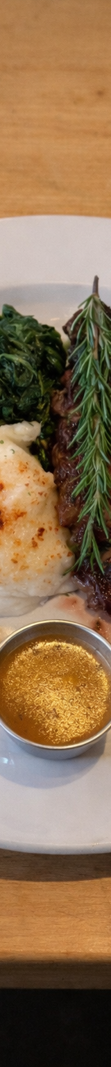 New York Strip Steak with Mashed Potatoes and Sautéed Spinach