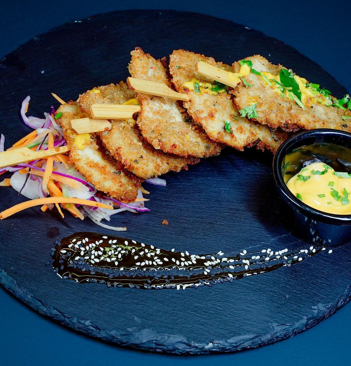 Breaded Chicken Cutlet with Salad and Sauce