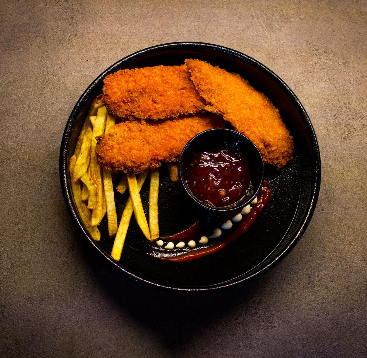 Breaded Chicken Strips with French Fries and Ketchup