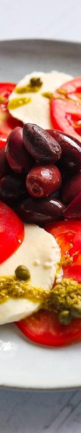 Caprese Salad with Black Olives and Pistachio Pesto