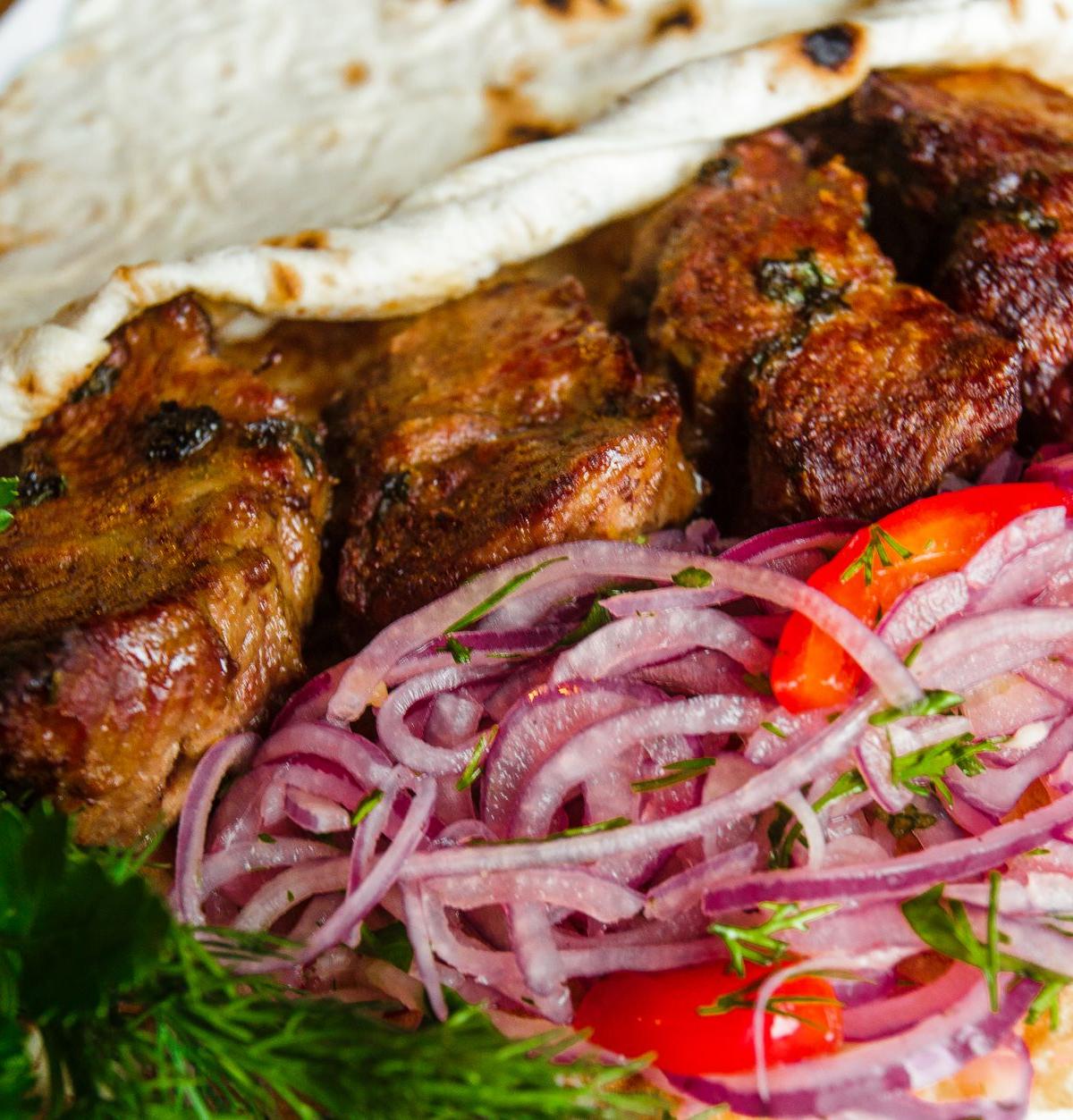 Grilled Meat Kebabs with Onion Salad and Flatbread