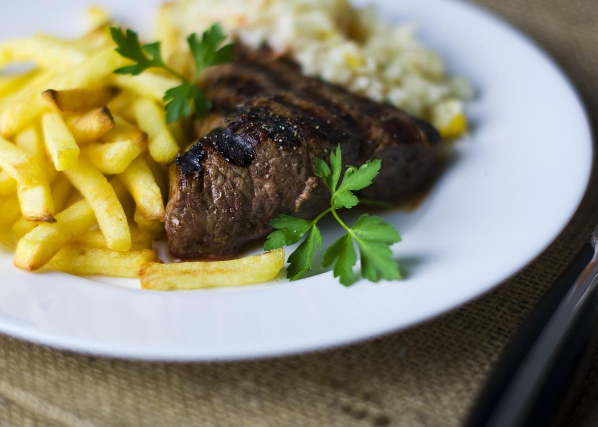 Grilled Steak with French Fries and Potato Salad