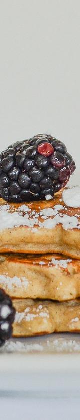 Pancakes with Blackberries and Powdered Sugar