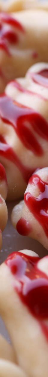 Sweet Pierogies with Strawberry Sauce and Sour Cream