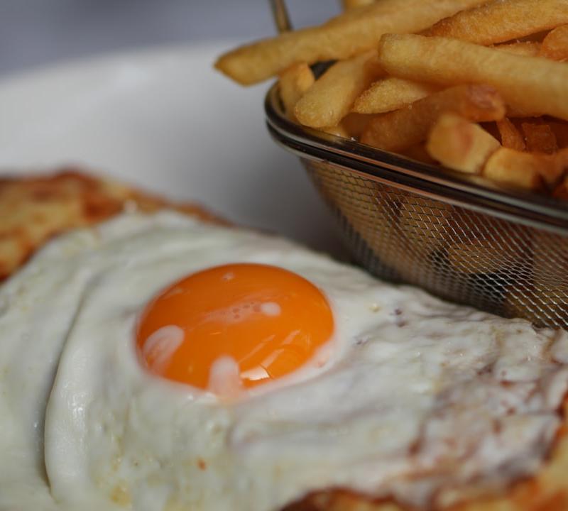 Crispy Bacon-Cheese Pork Schnitzel with Fries & Egg