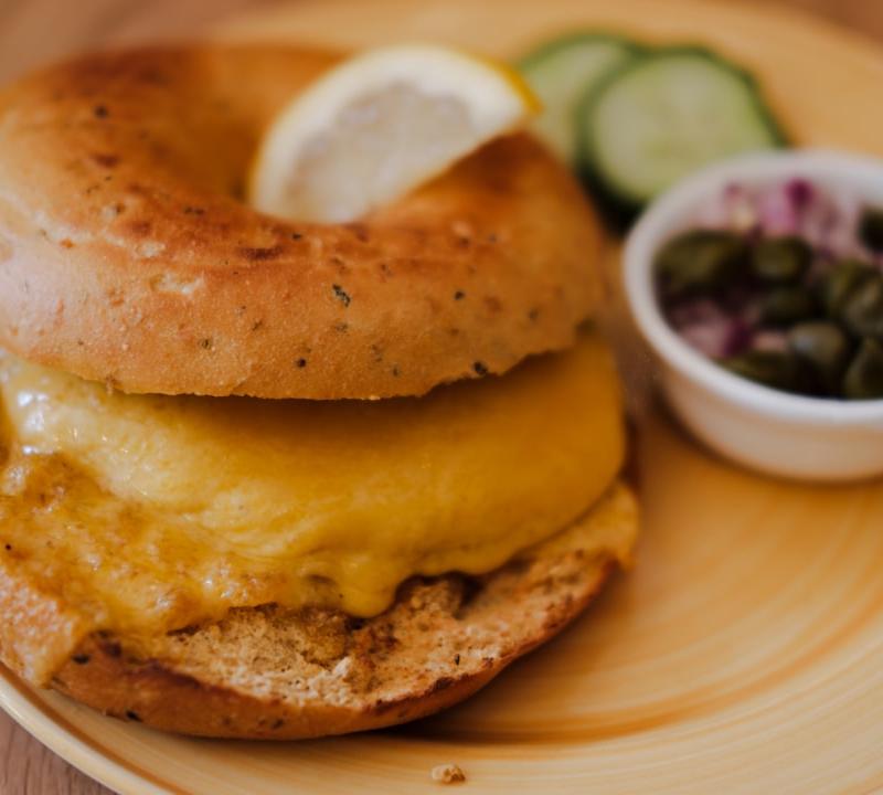 Crispy Bacon Egg Bagel with Capers & Red Onion