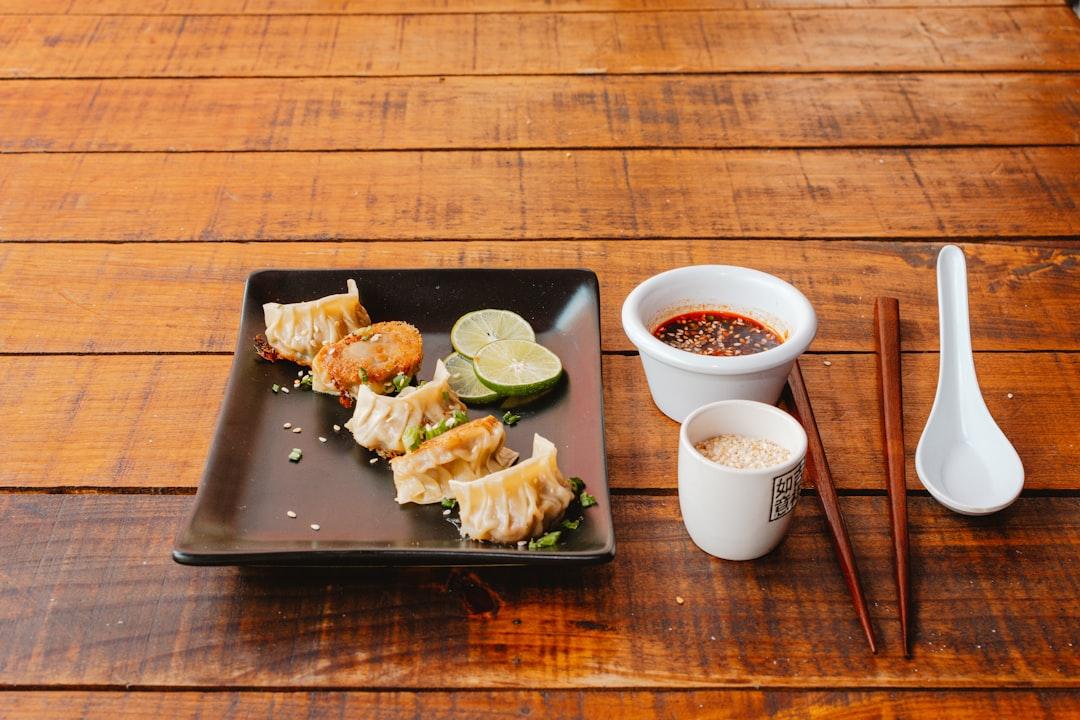 Pan-Fried Shrimp and Fish Dumplings with Peanut Sauce