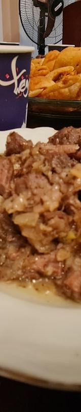 Peppered Grilled Lamb Asun with Jollof Rice & Puff Puff