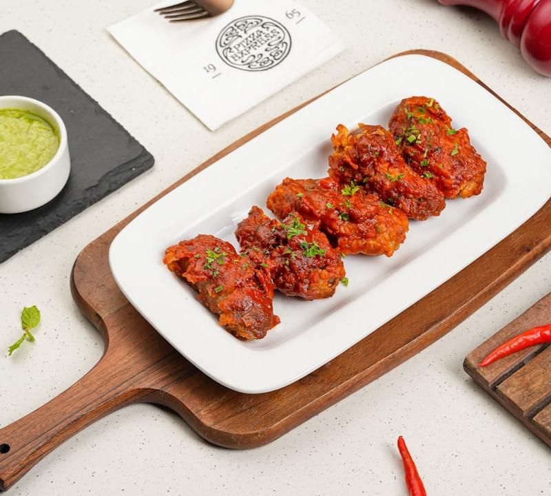 Baked Cajun Wings with Green Sauce